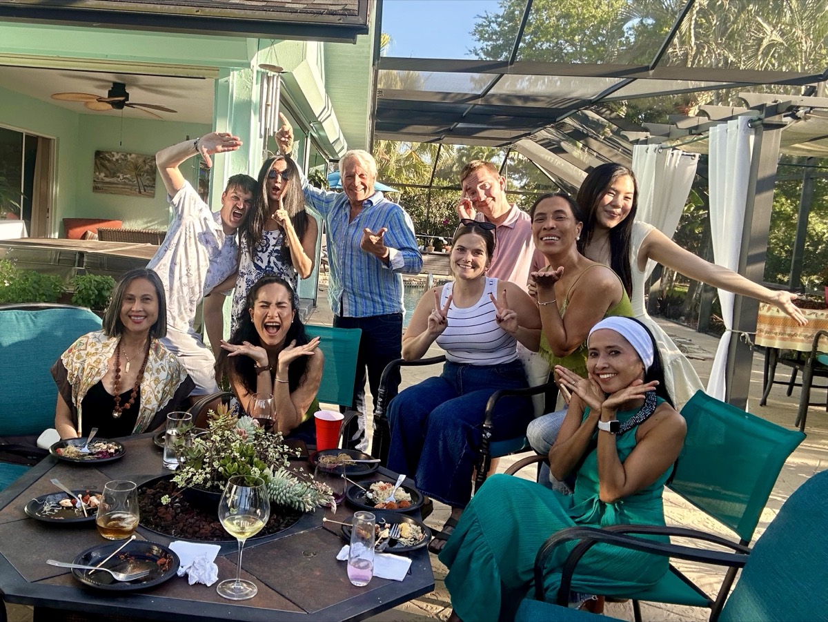 APWS members gathered around a potluck table