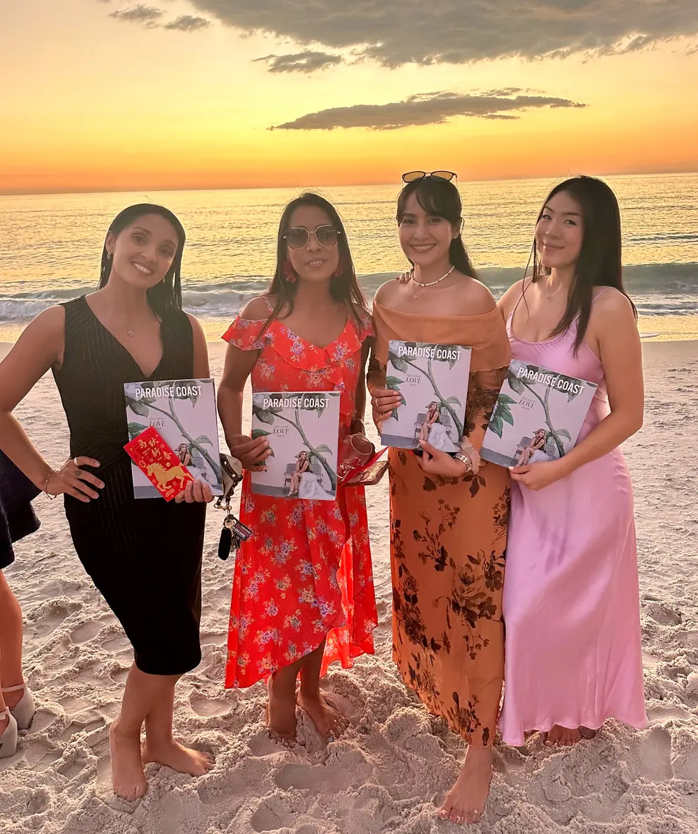 Four members on the beach at sunset