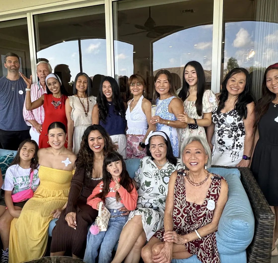 Members, families and friends gathered on a lanai